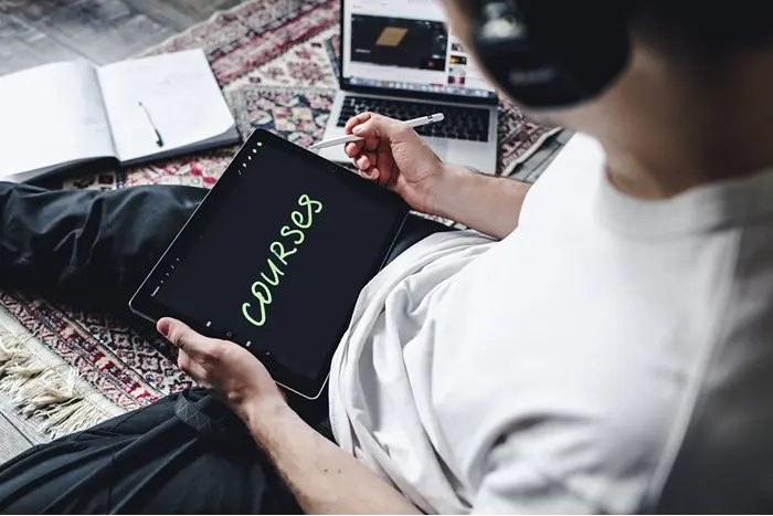 Learner using a digital tablet for accredited CPD online courses, supporting flexible learning and professional development.
