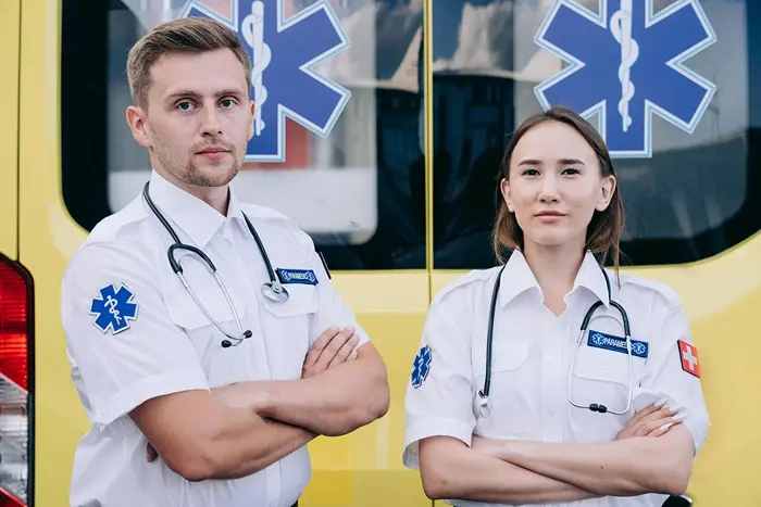 Paramedics standing beside an ambulance, representing accredited healthcare CPD courses and professional development.